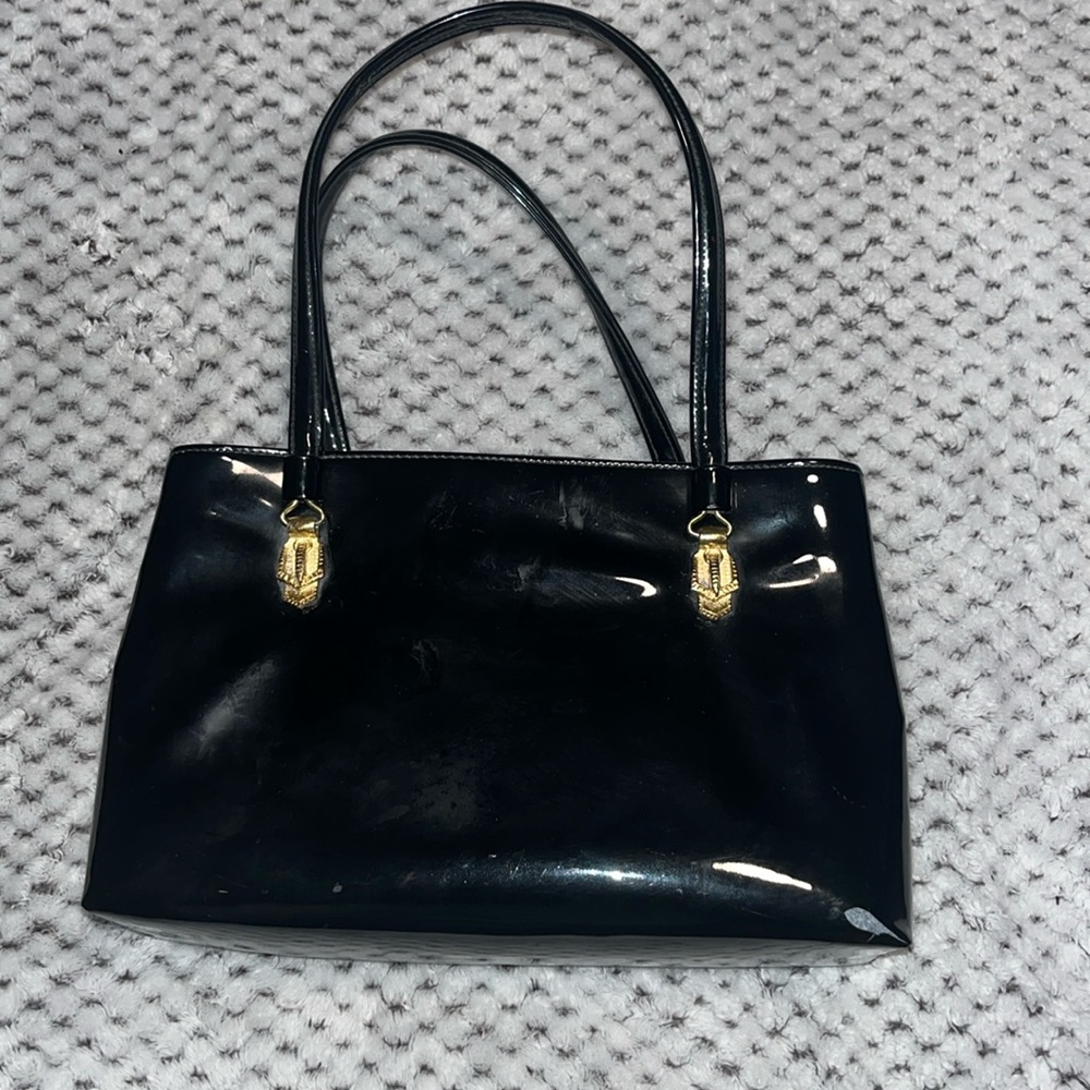 Vintage Lewis black patent leather handbag tier handbag with gold accents.